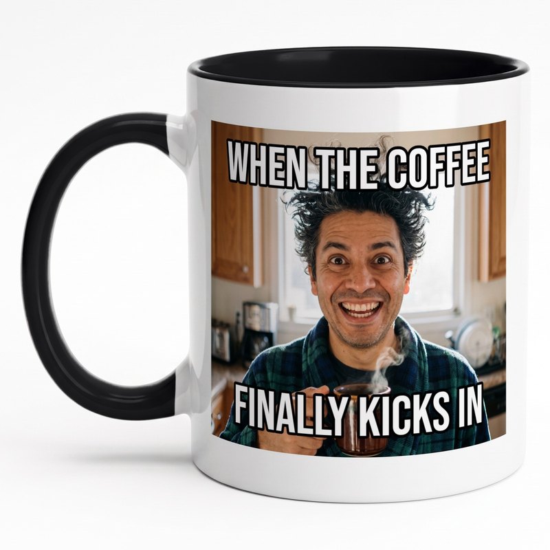 A black-rim meme mug with a wide-eyed man in a bathrobe and "When the coffee finally kicks in"