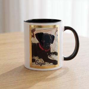 A 24K gold mug we made: a black puppy named Gaja in a gold leaf border